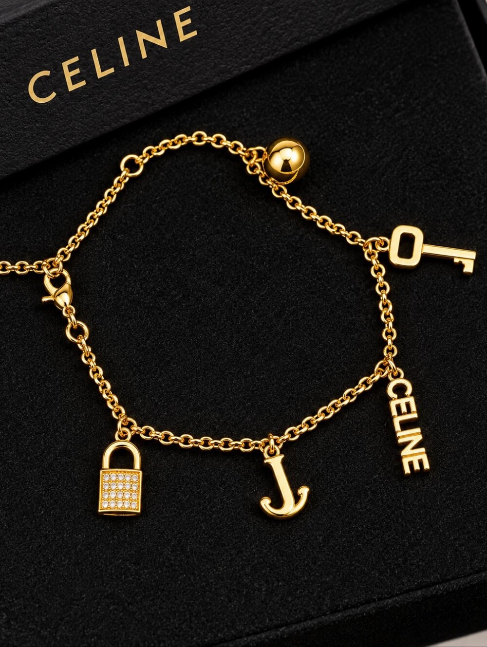 18kgp Celine Gold-Tone Charm Bracelet with Letter and Key Charms